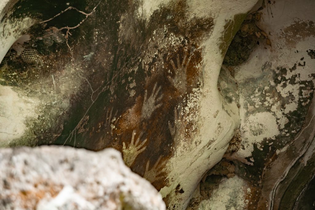 Hand Stencils in Leang-leang Cave by Christoper Tambanua